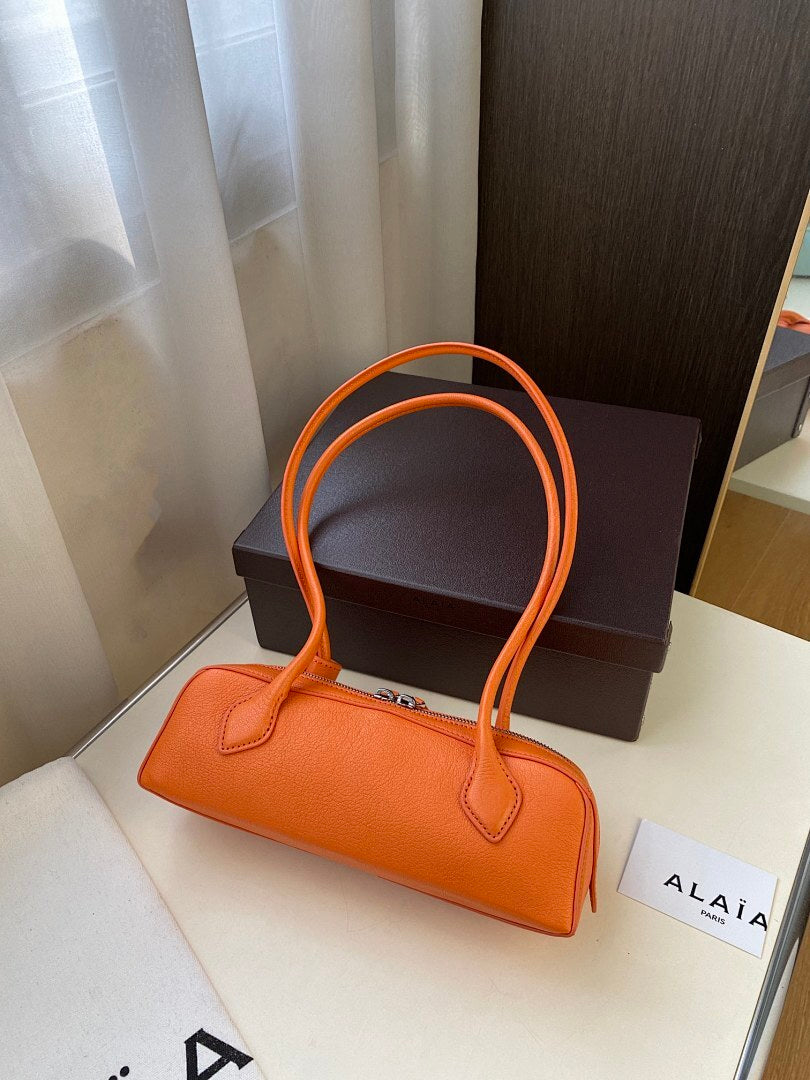 Alaïa Pebbled Leather Shoulder Bag – Orange