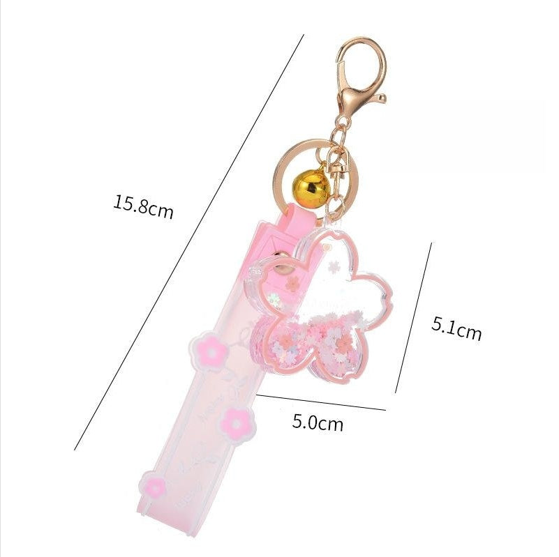 Cartoon-Treibsand-Kirschblüten-Schlüsselanhänger, transparentes Acryl-Öl-Treibflaschen-Taschenanhänger-Set