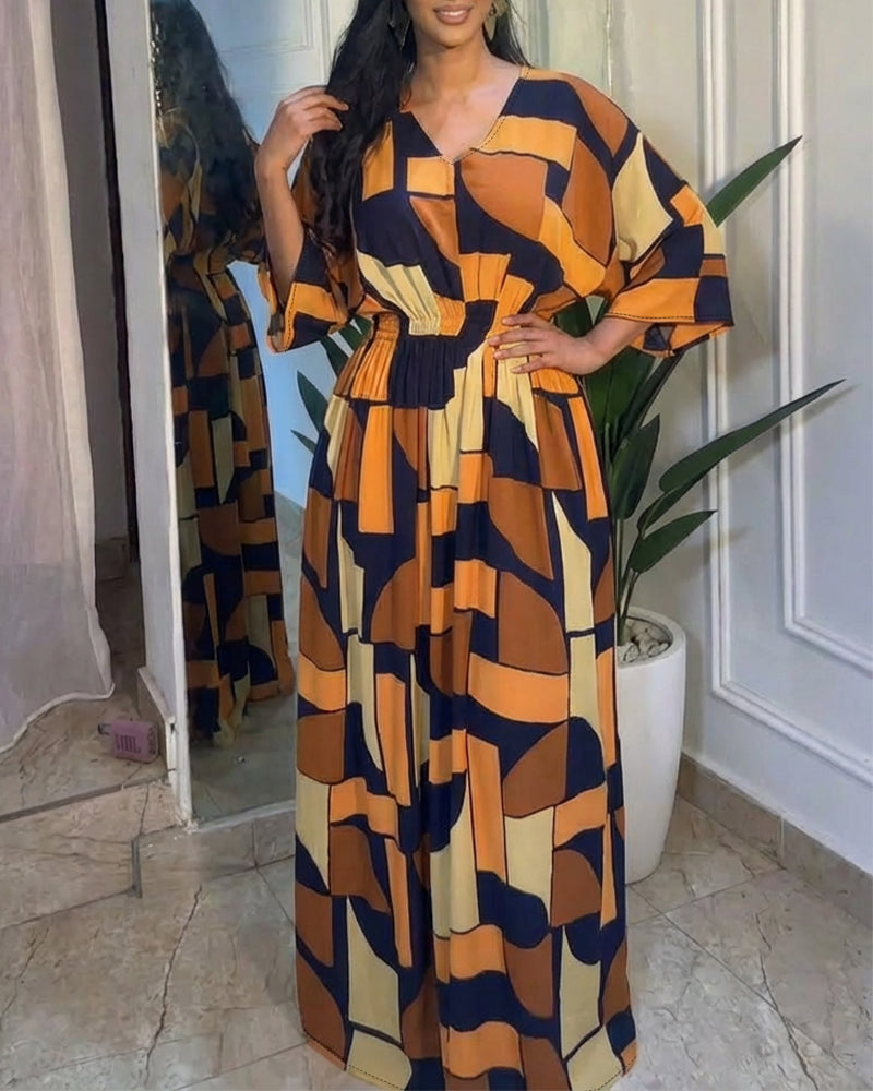 Colorblock-Jumpsuit mit geometrischem Druck, V-Ausschnitt, Fledermausärmeln, geraffter Taille und weitem Bein