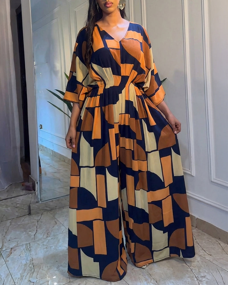 Colorblock-Jumpsuit mit geometrischem Druck, V-Ausschnitt, Fledermausärmeln, geraffter Taille und weitem Bein