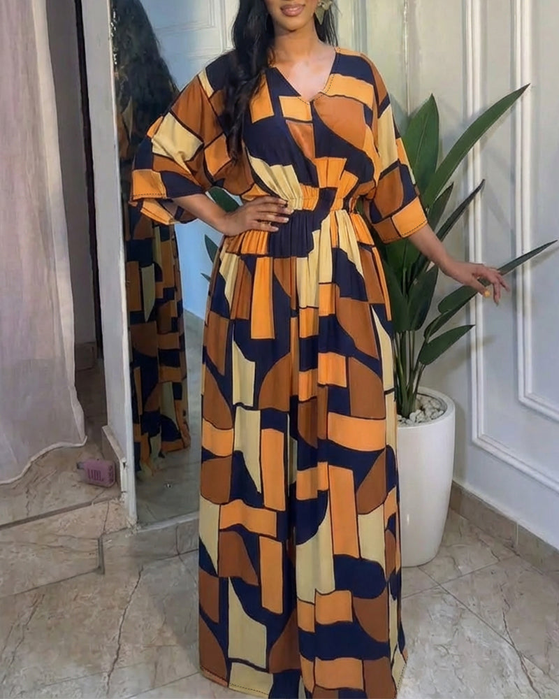 Colorblock-Jumpsuit mit geometrischem Druck, V-Ausschnitt, Fledermausärmeln, geraffter Taille und weitem Bein