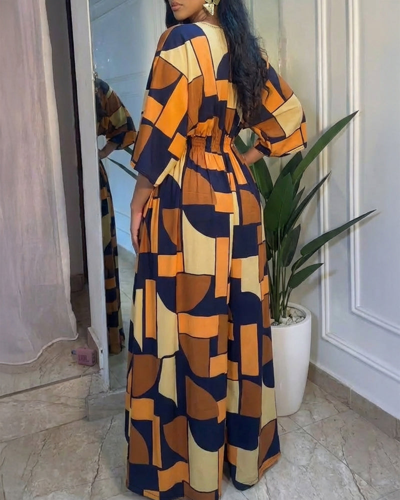 Colorblock-Jumpsuit mit geometrischem Druck, V-Ausschnitt, Fledermausärmeln, geraffter Taille und weitem Bein