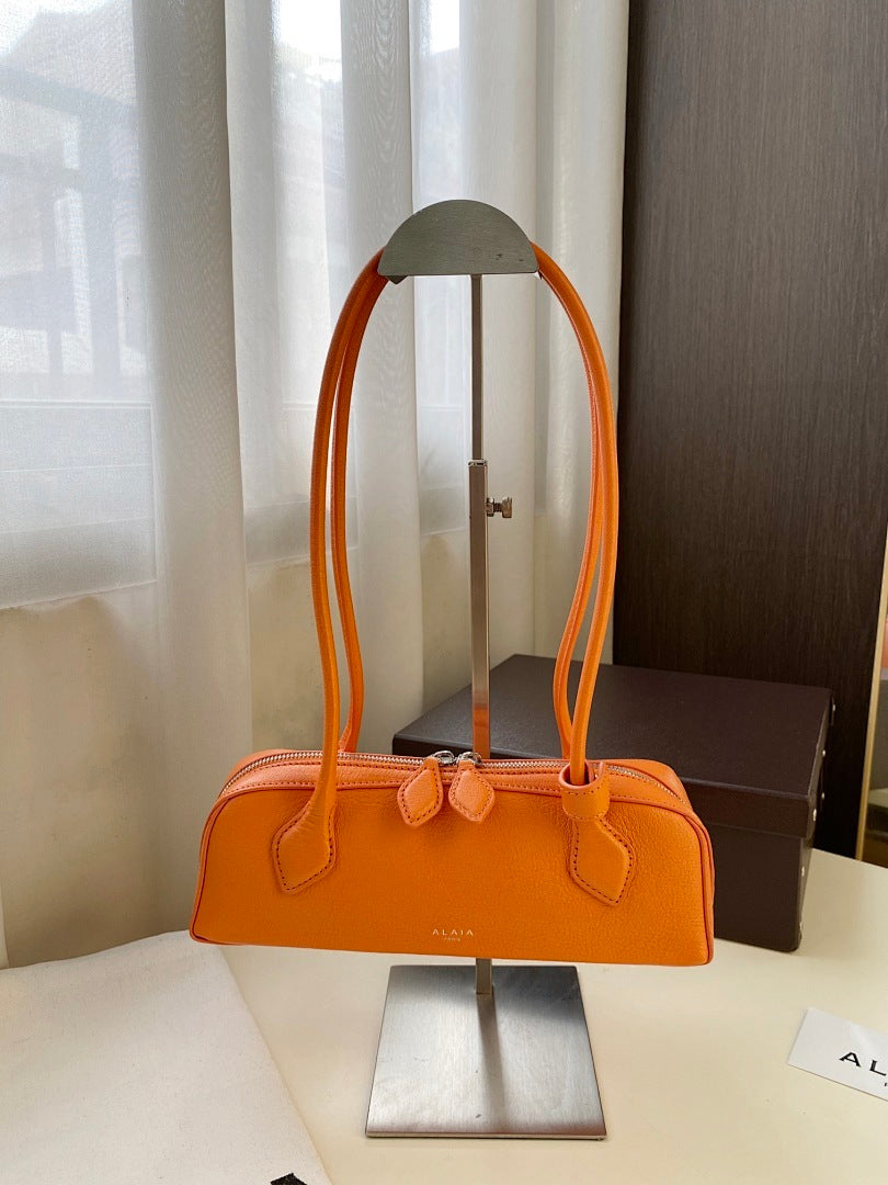 Alaïa Pebbled Leather Shoulder Bag – Orange