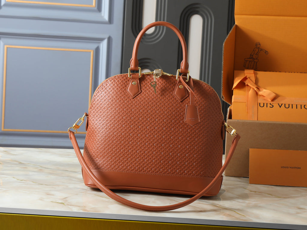 Alma Monogram Empreinte Leather Bag