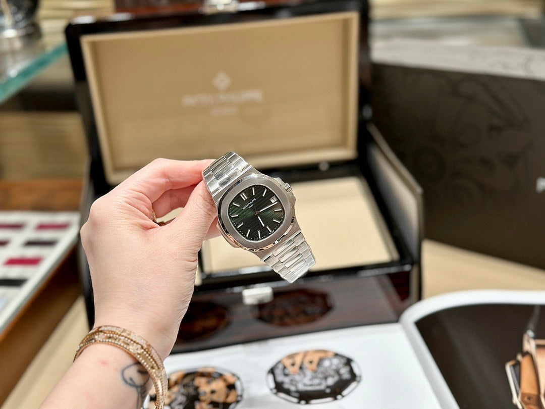 Patek Philippe Nautilus 5711 – Steel Olive Green Dial Baton Indices Date Integrated Steel Bracelet