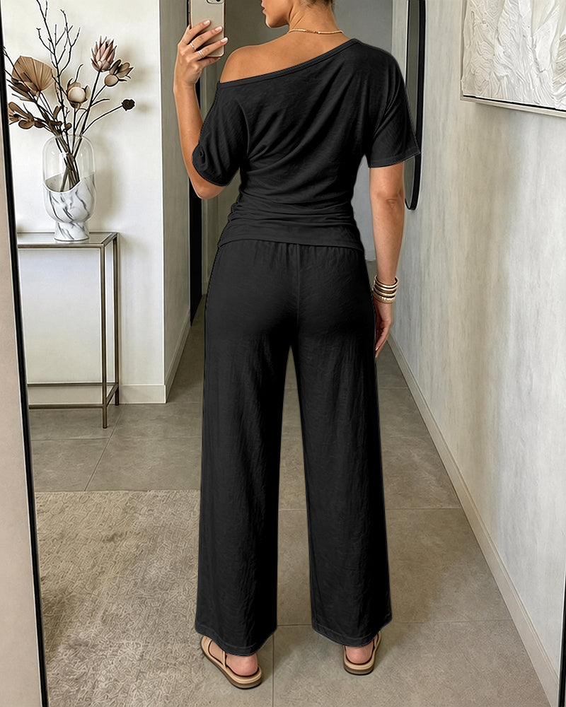 Damen 2-teiliges Set mit schrägem Ausschnitt, gerafftem Oberteil mit Bindegürtel und kurzärmeligem Shirt sowie Hose mit weitem Bein und hoher Taille