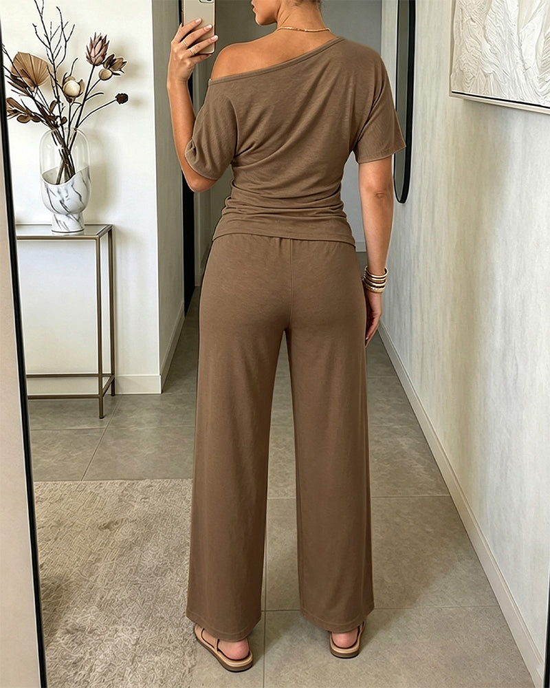 Damen 2-teiliges Set mit schrägem Ausschnitt, gerafftem Oberteil mit Bindegürtel und kurzärmeligem Shirt sowie Hose mit weitem Bein und hoher Taille