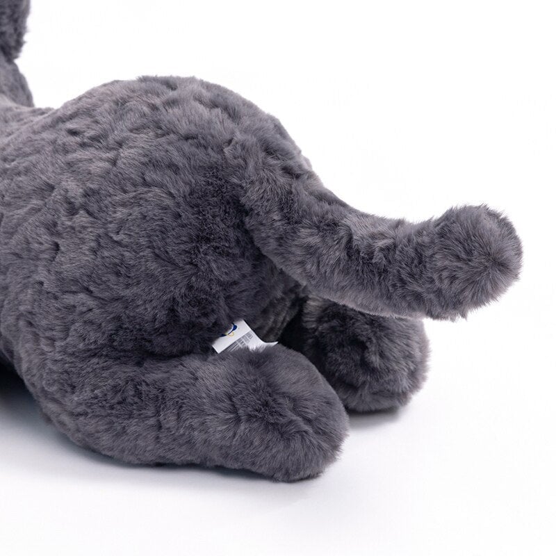 Jiji the Fluffy Black Cat Plushie Laying Down